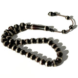 Black Kawk, adorned with metal and stones, 10 mm, 33 beads