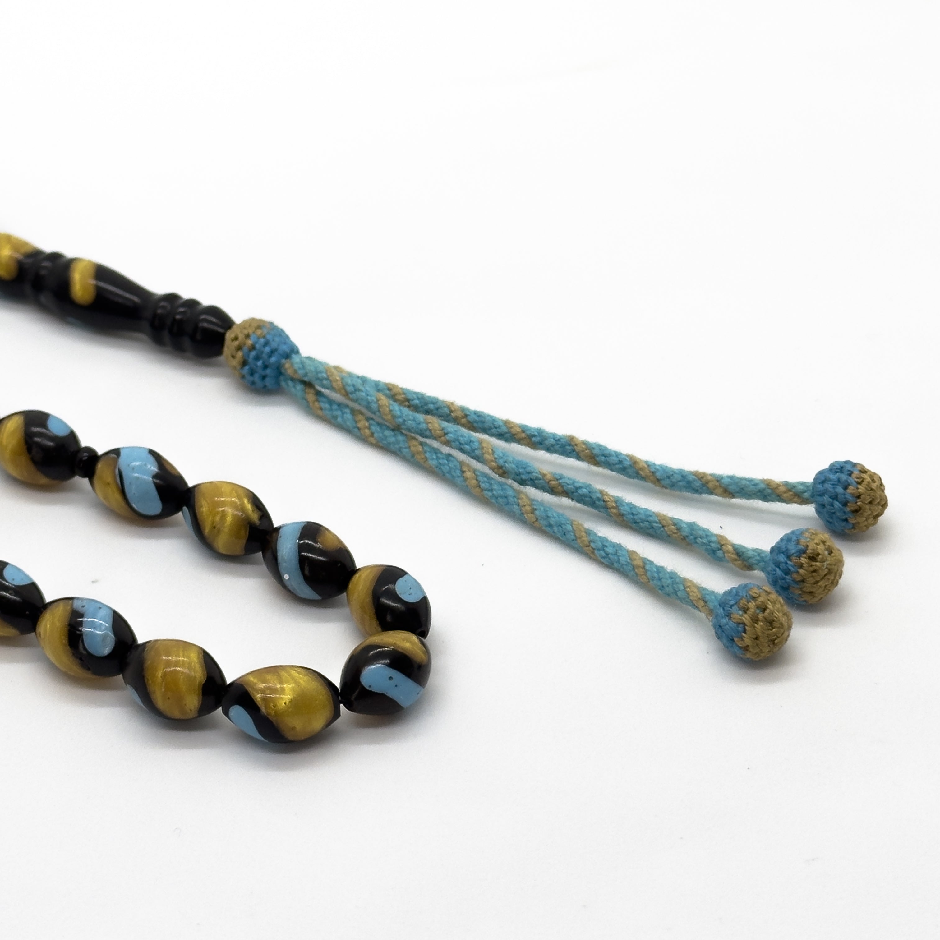 سبحة كوك اسود مطعم بالفيروز وتراب الكهرمان 10 مم 33 حبة