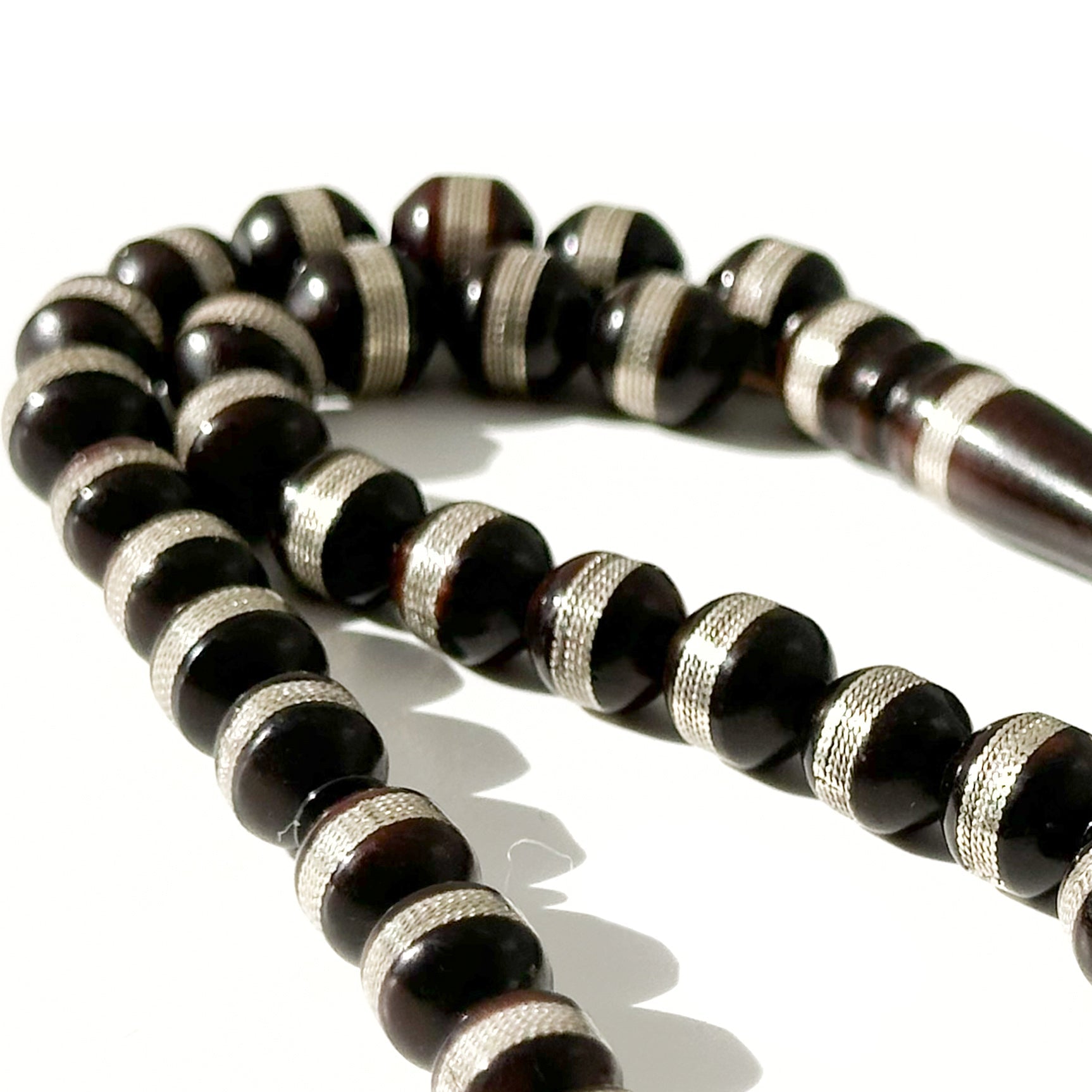 Black Kawk, adorned with metal and stones, 10 mm, 33 beads